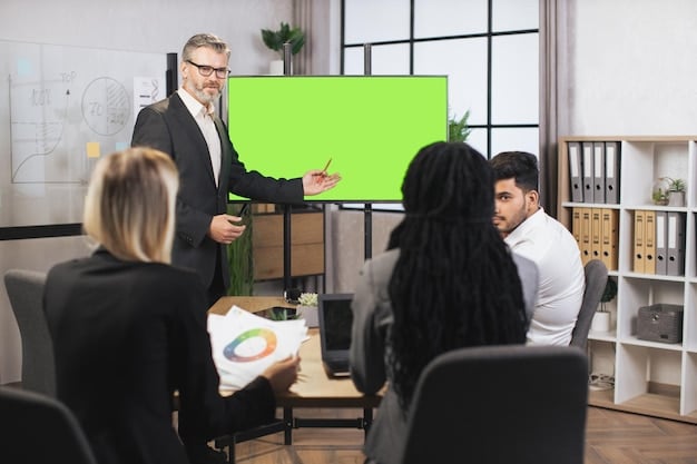 A person pointing to a slide during a board meeting presentation explaining the roles and responsibilities of board members, highlighting key duties and expectations.