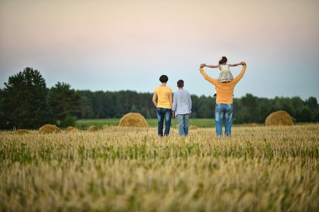 A family standing on their property, looking over rolling hills and farmland after establishing a conservation easement. The image represents the peace of mind and environmental stewardship that conservation easements provide to landowners.