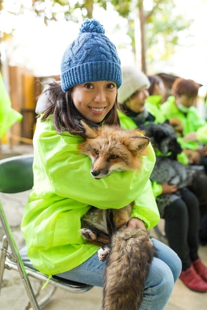 A diverse group of people actively volunteering at an animal rescue event, sorting donations and caring for animals, with tax documents subtly in the background.
