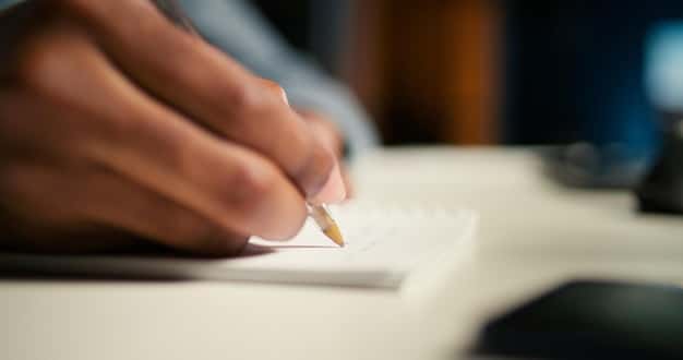 A close-up shot of a hand meticulously filling out a complex IRS Form 1023 with a pen, surrounded by stacks of legal documents and non-profit bylaws, symbolizing the detailed application process.